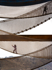 Interesting views of children climbing on the net platform in the children's playground