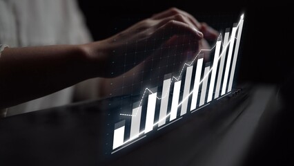 A close-up shot of hands typing on a keyboard, overlaid with a sleek graph visualization that indicates growth and data analysis, ideal for business contexts. Copula