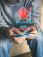 User Receiving a Critical Email Security Alert Danger Notification on a Mobile Phone Warning of Cyber Threat © Fabio Principe
