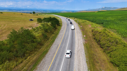 a road in the countryside among green hills