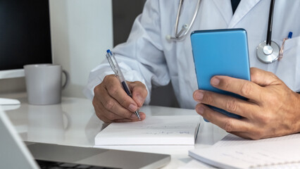 Doctor engaging with a smartphone in a modern medical setting, seamlessly integrating digital tools into patient care