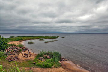 A picturesque eco-trail along a slope on the shore of Lake Peipus. The grounds of the Peski Park Hotel. Zapolye village, Gdovsky District, Pskov Region, Russia.