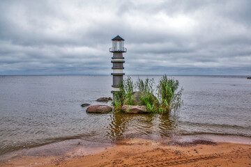 A fake decorative lighthouse on Lake Peipus. The grounds of the Peski Park Hotel. Zapolye village, Gdovsky District, Pskov Region, Russia