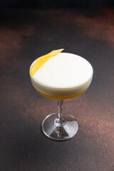 A delicious alcoholic cocktail at the bar. The bartender prepares cocktails