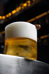 A delicious alcoholic cocktail at the bar. The bartender prepares cocktails