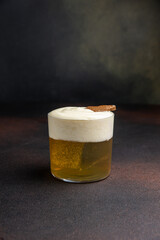 A delicious alcoholic cocktail at the bar. The bartender prepares cocktails