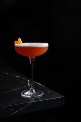 A delicious alcoholic cocktail at the bar. The bartender prepares cocktails