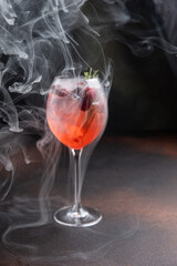 A delicious alcoholic cocktail at the bar. The bartender prepares cocktails