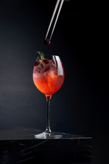 A delicious alcoholic cocktail at the bar. The bartender prepares cocktails