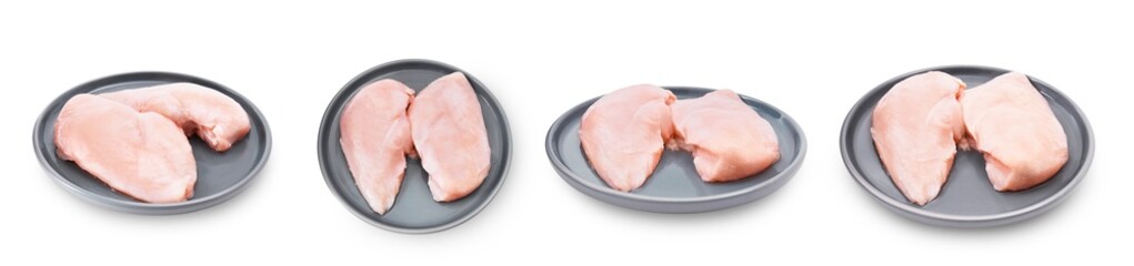A horizontal studio shot of four pairs of raw boneless, skinless chicken breasts served on gray plates. Isolated on transparent background.