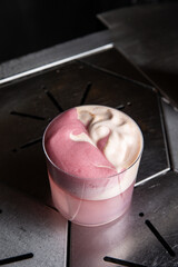 A delicious alcoholic cocktail at the bar. The bartender prepares cocktails