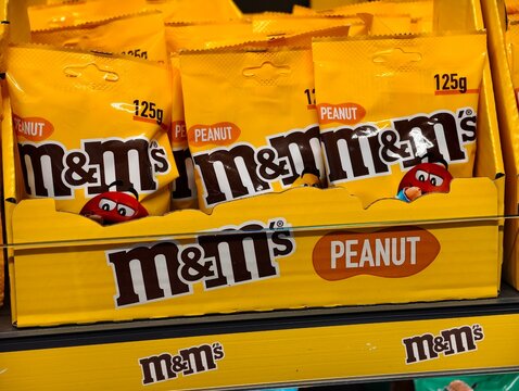 Airolo,Switzerland-Sep.30th 2025: M&M's Peanut chocolate candy bags displayed on a store shelf