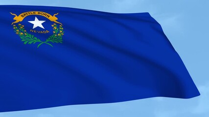 Nevada flag is waving against a clear blue sky.