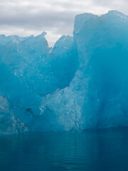 Beautiful bright blue iceberg floating in Iceland's Jokulsarlon Glacier Lagoon