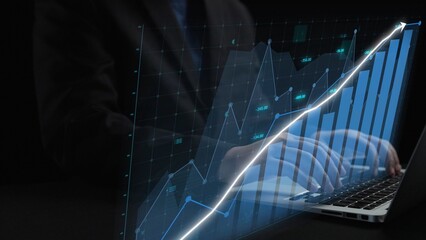 This image depicts a professional workspace where a person uses a laptop to analyze business data, showcasing growth trends through digital graphs and visualizations. Copula