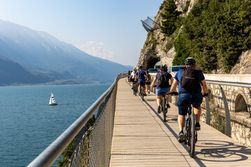 Breathtaking view on the famous "Ciclopista del Garda" in Limone sul Garda, Italy. This suspended pathway over the water offers spectacular views of the lake and surrounding mountains