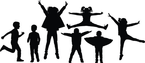 Silhouettes of joyful children jumping and playing with arms raised in the air