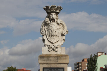 sculpted lion and blazon at the charles III bridge in miranda de ebro in spain 