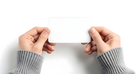 Hands holding blank horizontal white paper card isolated on white background for design mockup