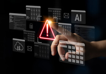 A hand interacts with a bright warning sign in a digital technology interface showcasing various data elements and notifications against a dark backdrop. Gantry