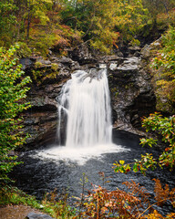 Fototapeta premium Portrait of the Falls of Falloch, situated in the north of Loch Lomond and The Trossachs National Park, Falls of Falloch is a beautiful waterfall just 3 miles from the village of Crianlarich