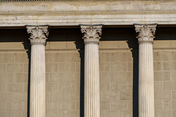 Naklejka premium Columns and wall of an old building as an abstract background, architectural details