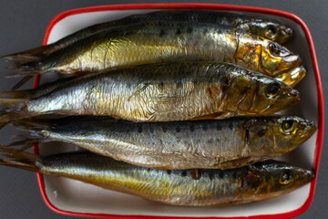 Freshly Caught Sardines on a Red Tray Perfect for Seafood Delicacies and Culinary Creations