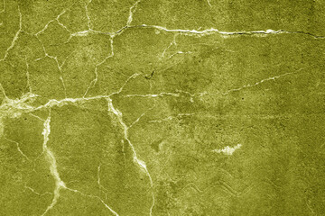 Cracked cement wall texture. yellow toned.
