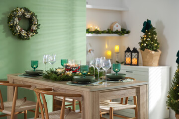 Festive table setting with Christmas decor indoors