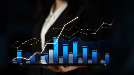 A businesswoman presents a tablet showcasing a financial chart with dynamic growth and data insights, symbolizing success in investment and market analysis. Scalp