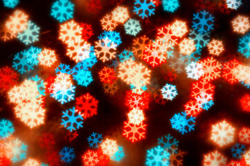 Christmas festive background. Blurred Christmas background, holiday Christmas glowing color lights with sparkles
