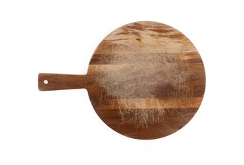 Old round wooden pizza board with handle isolated on white background