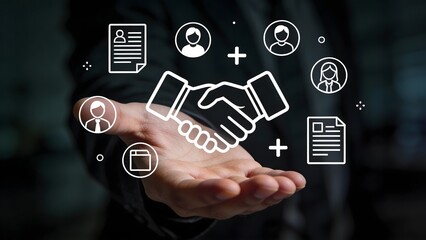 Handshake icon with business symbols