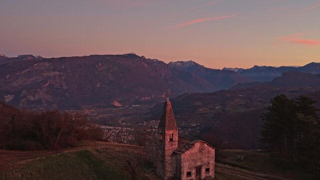 Panorama al tramonto della Chiesa di Sant'Apollonia Vergine e Martire a Manzano in Valle di Gresta in Trentino - Alto Adige