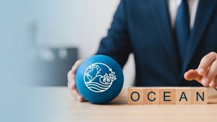 Ocean sustainability. Business hand selecting ocean protection symbol showing corporate commitment to marine conservation.