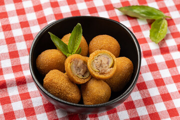 Olive all'ascolana, also known as olive ascolane ripiene, is an Italian appetizer of fried olives stuffed with meat.  Italian Appetizer or antipasto.