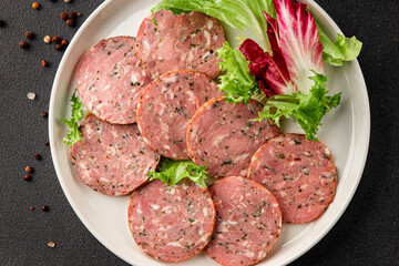 Sausage with garlic and spices slices of salami meat tasty snack fresh gourmet food background on the table rustic food top view copy space