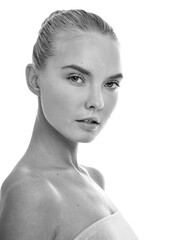 Beautiful face of young adult woman with clean fresh skin. Looking at Camera.