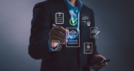 Business experts are reviewing ISO documents and digital checklists, concept of communicating quality assurance, compliance audits and organizational standard processes