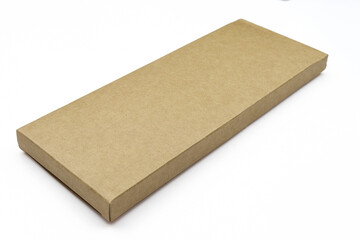 Thin brown blank paper box isolated on white background. rectangle cardboard mockup case