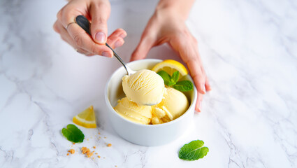 Ice cream with fruits mint lemon in a bowl on a plate