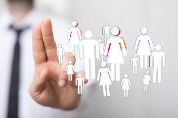 Close-up of a hand pointing to floating people icons, symbolizing connection, teamwork, and networking. Ideal for business, social media, and co