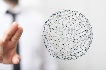 Close-up of a hand reaching towards a connected network sphere, symbolizing technology, digital world, and communication. Perfect for data, busi