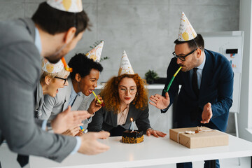 Business Colleagues Celebrating a Birthday with a Cake in the Office