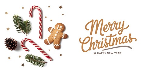 Merry christmas text with festive holiday decorations and gingerbread man
