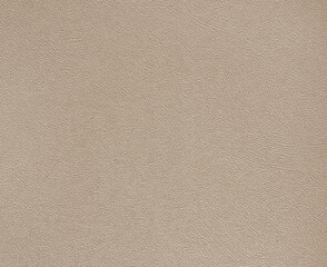 Fototapeta premium Decorative peach or beige textured paint on a surface. Random limestone peach beige color washed paint with grunge, and dirt pattern. Seamless background texture. 