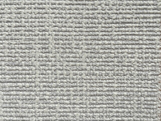 Close up of white 3D fluted stripes background with rough surface. Suitable for wallpaper, wallpanel, fabric, or upholstery. Fluted linen stripes pattern. Seamless background texture.
