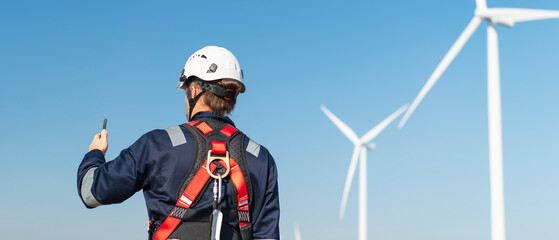 Engineers inspect wind turbine systems to ensure efficient electricity generation from clean, renewable energy.