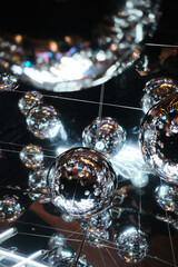 Mirror balls creating abstract reflections with sparkling lights