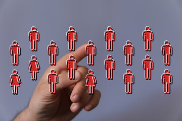 Hand pointing at human network concept, social connection and teamwork, digital illustration of people icons. N